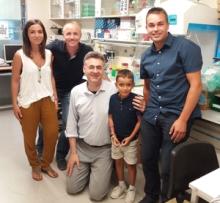 Dr. Carsten Bönnemann, center, with a young patient and his family; photo taken in Barcelona, courtesy of the Fundación Noelia